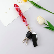 Load image into Gallery viewer, Floral Loop Macrame Wristlet
